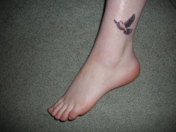 Flying Dove Tattoo On Girl Ankle