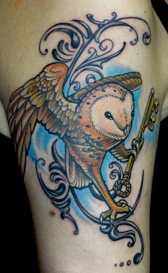 Flying Owl With Key In Claws Tattoo On Bicep