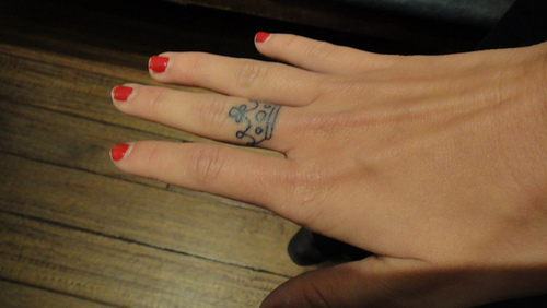 Girl With Crown Finger Tattoo