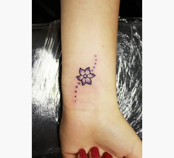 Girl With Flower Wrist Tattoo