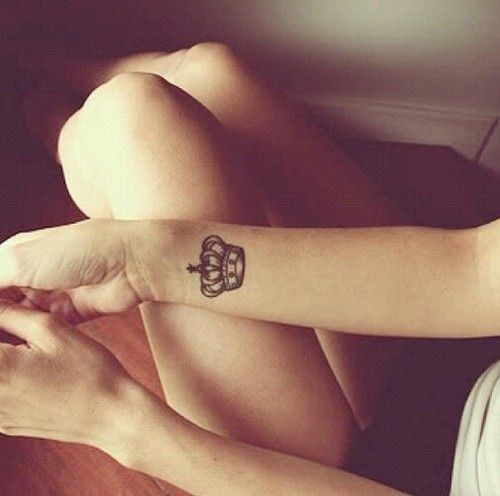 Girl With Grey Ink Wrist Crown Tattoo