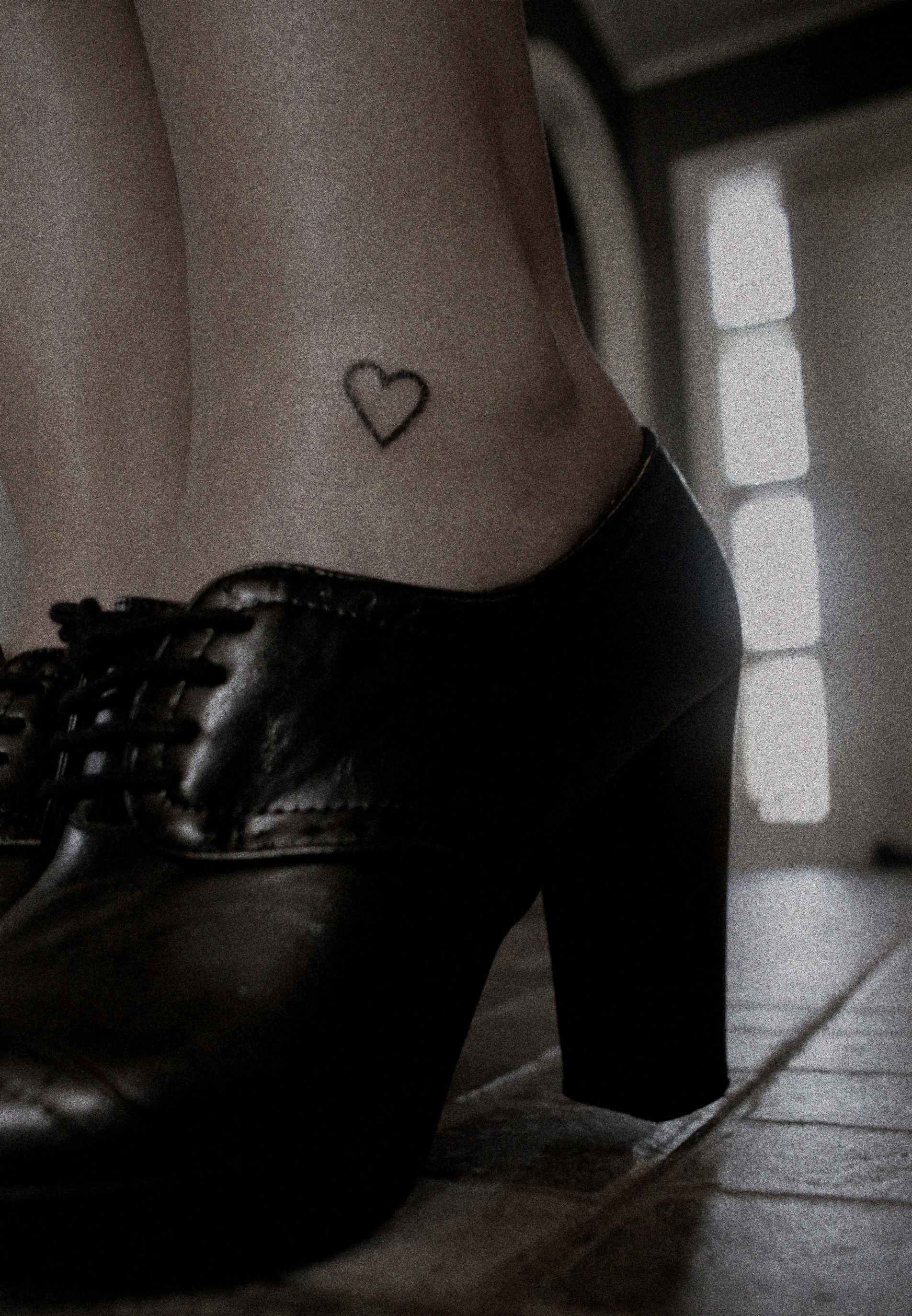 Girl With Outline Heart Tattoo