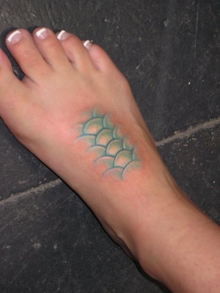 Green Ink Mermaid Scale Tattoo On Right Foot