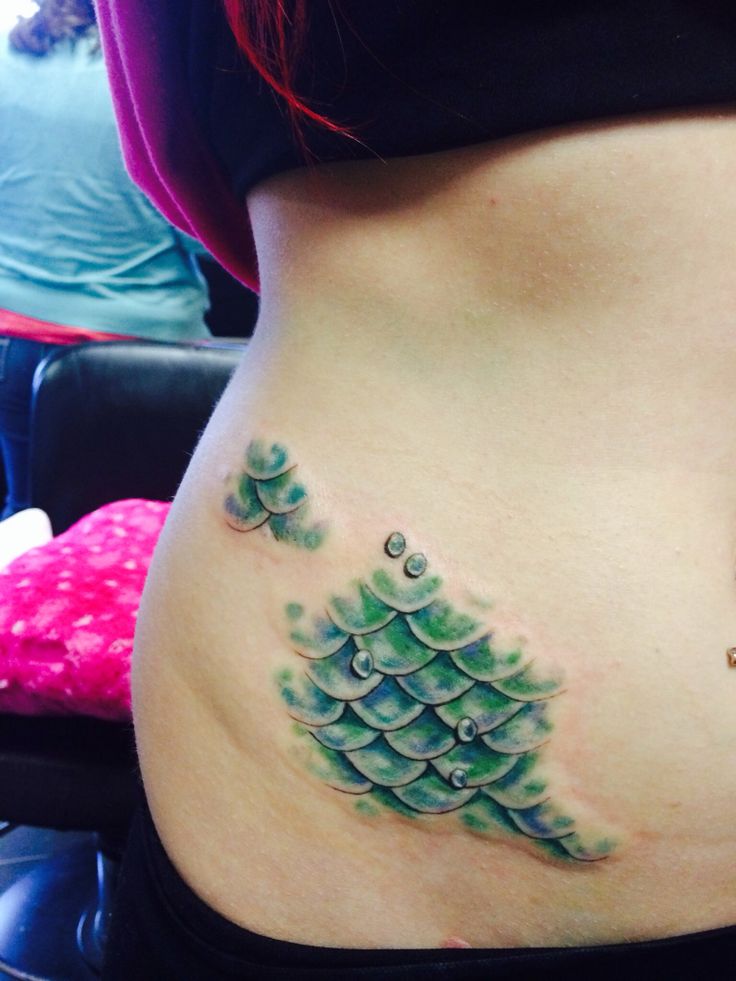Green Ink Mermaid Scale Tattoo On Right Hip