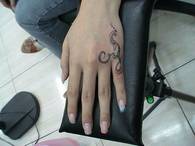 Grey And Black Tattoo On Side Hand For Women