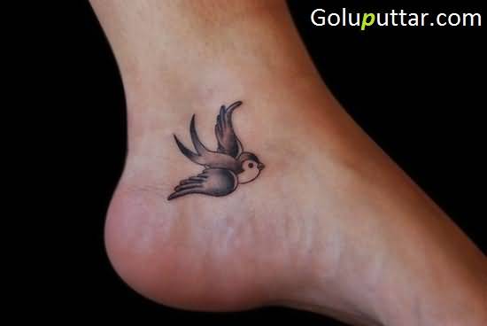 Grey Bird Flying Swallow Tattoo On Ankle