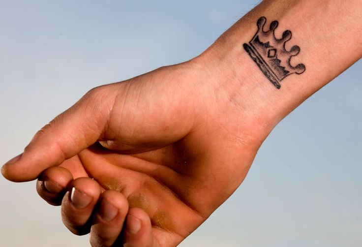 Grey Crown Tattoo On Right Wrist