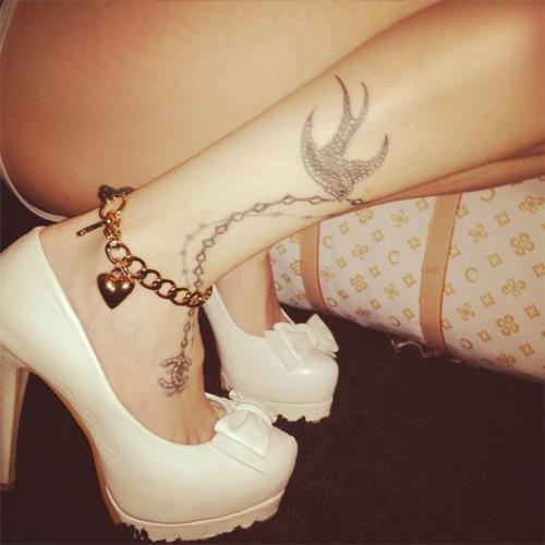 Grey Ink Flying Bird Ankle Tattoo For Girls