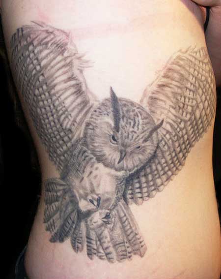 Grey Ink Flying Owl Tattoo On Side Rib