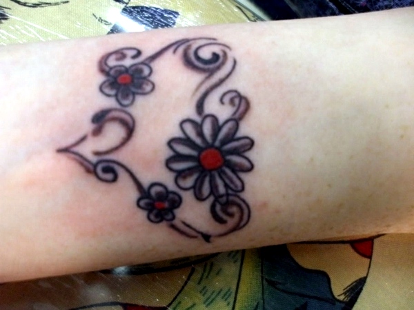 Grey Ink Tribal Heart And Daisy Flower Wrist Tattoo