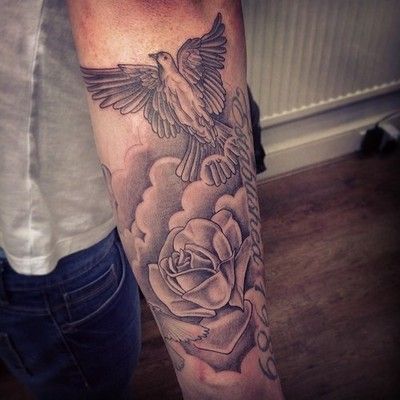 Grey Rose Flower And Flying Dove With Clouds Tattoo