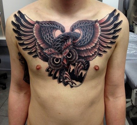 Guy With Flying Owl Tattoo On Chest