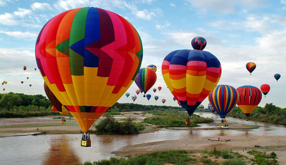 Hot Air Balloons Over A River During Albuquerque Balloon Festival