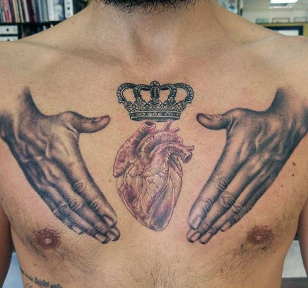 Human Heart And Crown Tattoo On Man Chest