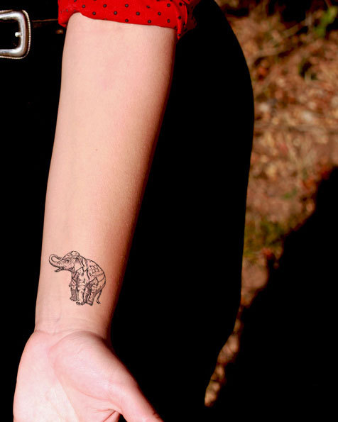 Latest Elephant Trunk Up Tattoo On Left Wrist