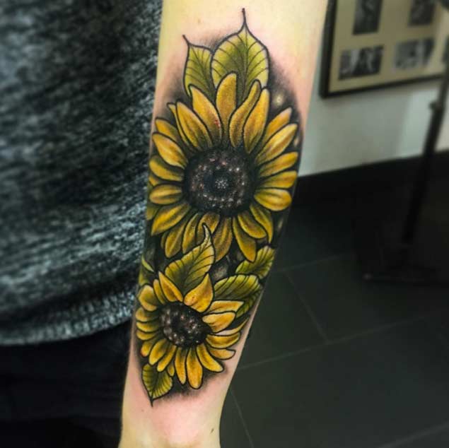 Left Arm Colored Realistic Sunflower Tattoo On Arm Sleeve
