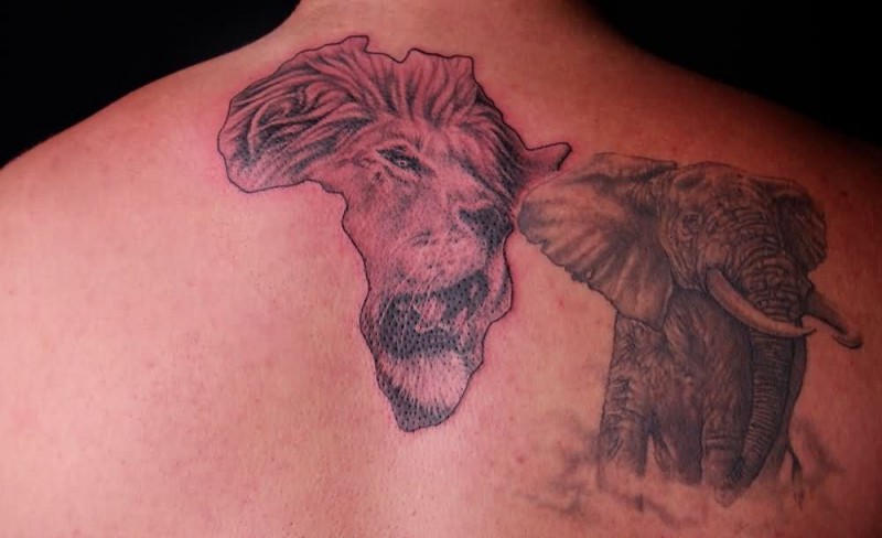 Lion Head In Africa Map With Elephant Tattoo On Upper Back