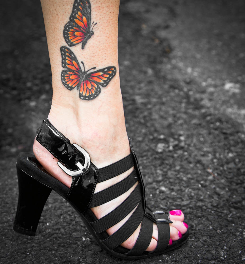 Lovely Monarch Butterflies Tattoo On Girl Ankle
