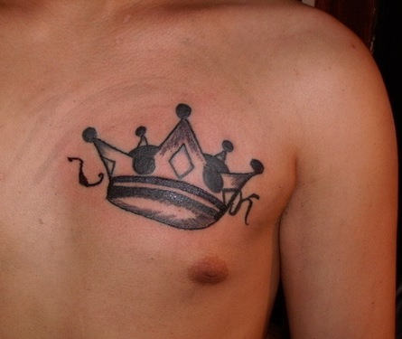 Man Chest Crown Tattoo Idea