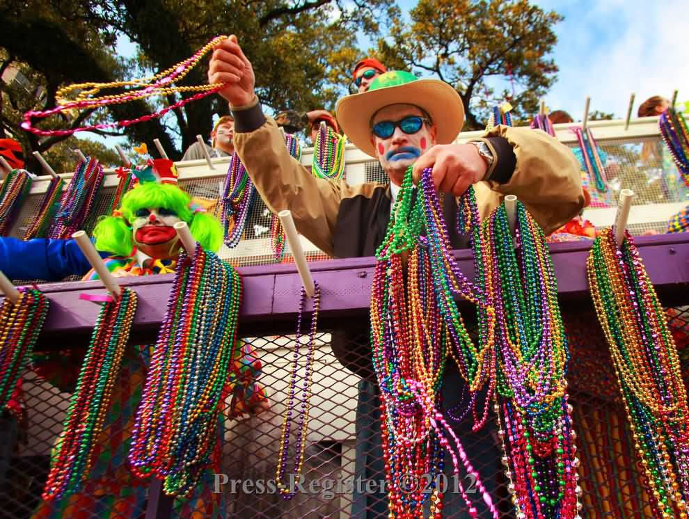 Man Distributing Pearl Beads During Mardi Gras Parade