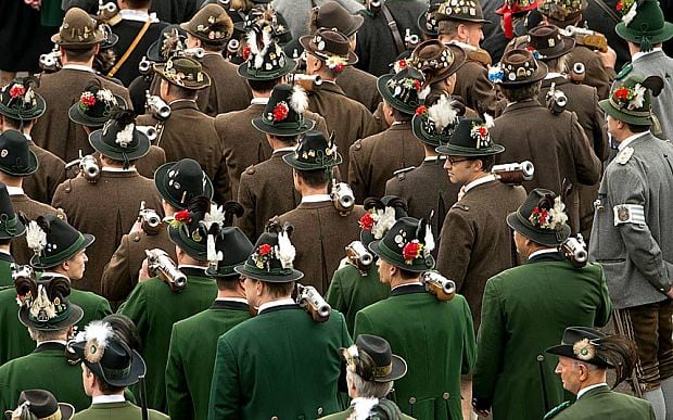 Men In Traditional Bavarian Costumes During Oktoberfest Celebration