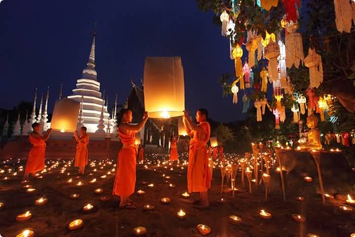 Monks Releasing Lanterns On Yi Peng Festival