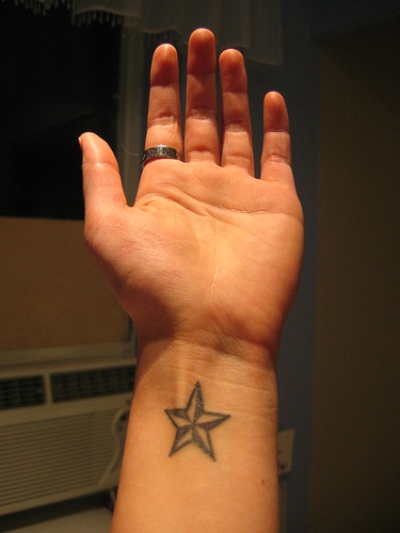 Nautical Star Tattoo On Man Left Wrist