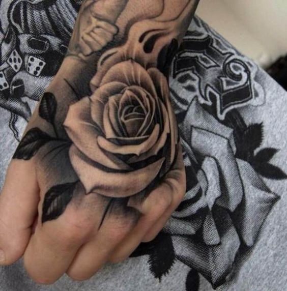 Nice Black And Grey Rose Tattoo On Left Hand