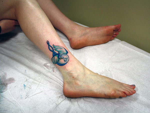 Nice Blue Ink Bird Tattoo On Right Ankle for Girls