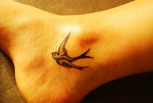 Nice Grey Bird Ankle Tattoo For Girls