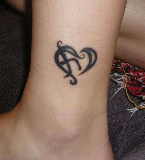 Nice Tribal Heart Tattoo On ankle