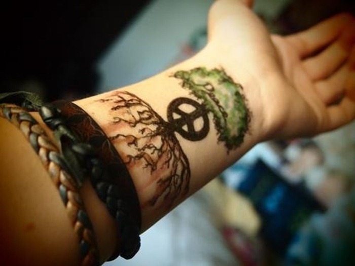 Peace Symbol And Tree Tattoo On Left Wrist For Men