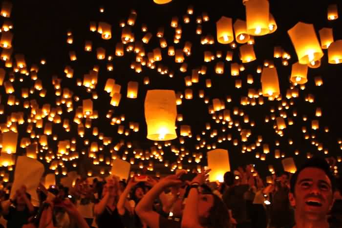 People Celebrating Yi Peng Lantern Festival In Thailand