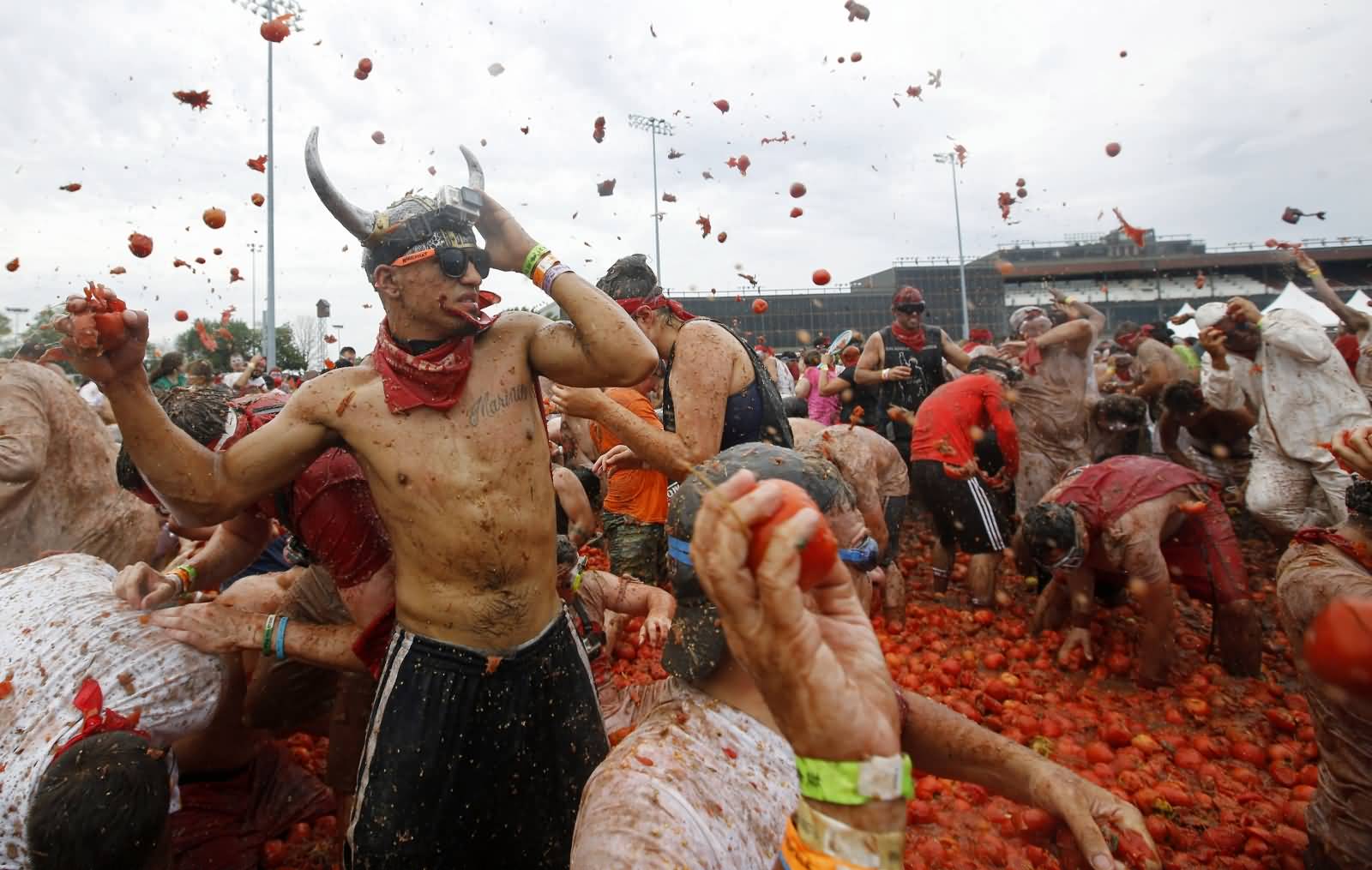 People Throwing Tomatoes On Each Other During La Tomatina Celebration