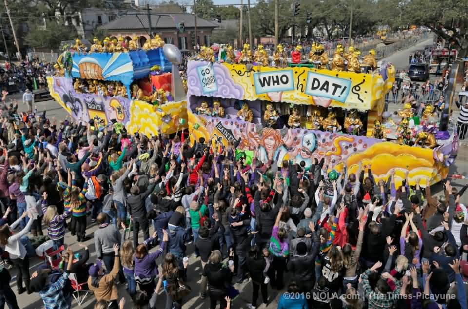 People Waving Hands To The Floats At Mardi Gras Parade