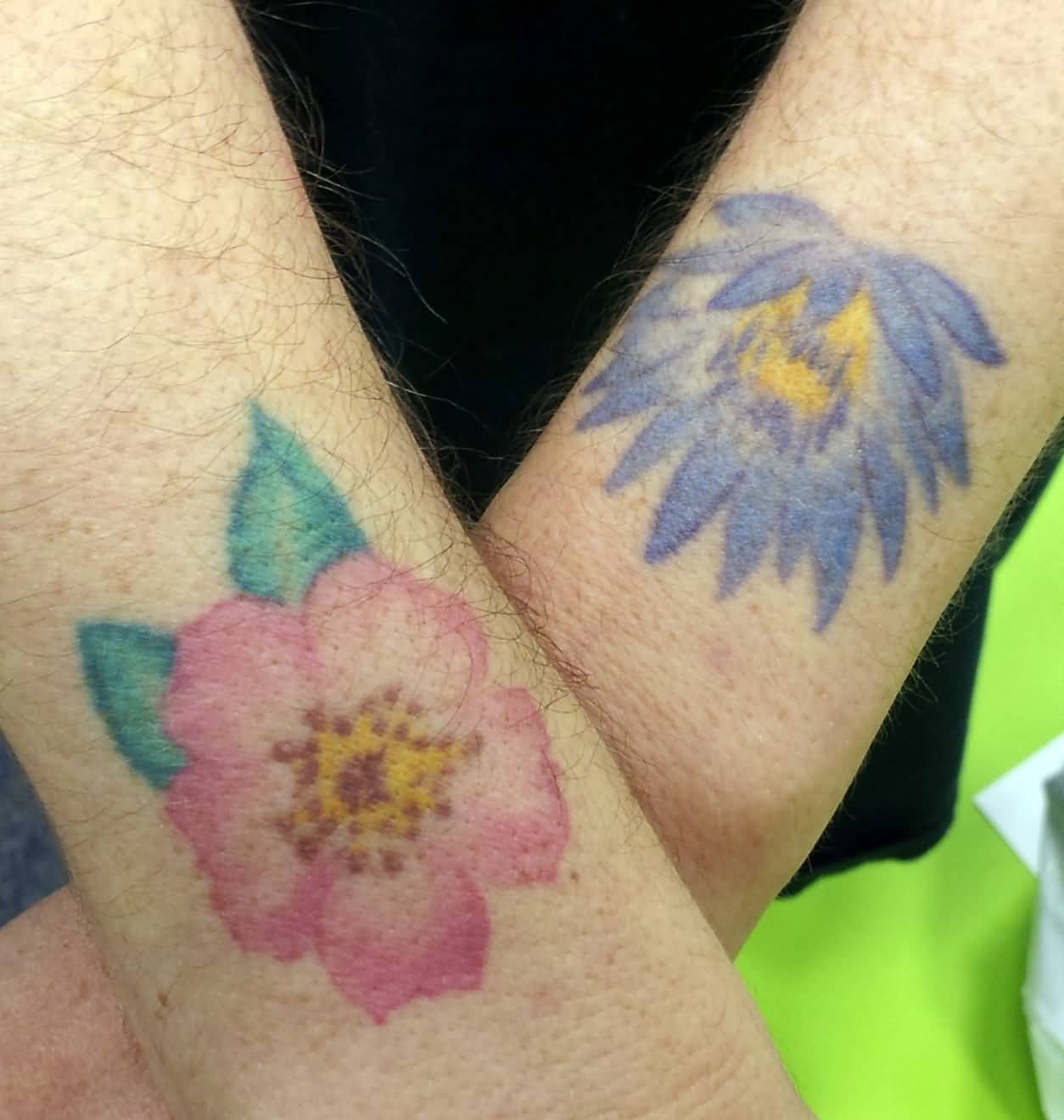 Pink And Purple Flower Wrist Tattoos