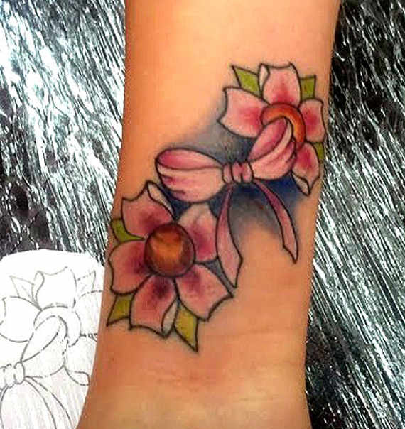 Pink Bow And Cherry Blossom Tattoo On Forearm