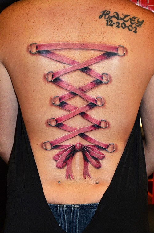 Pink Corset Tattoo On Girl Full Back