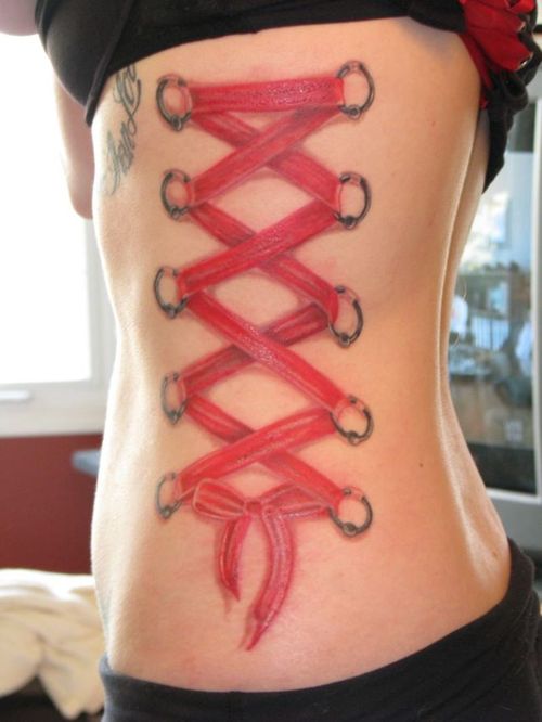 Pink Corset Tattoo On Side Rib For Girls
