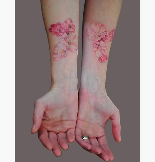 Pink Flowers Tattoos On Wrists