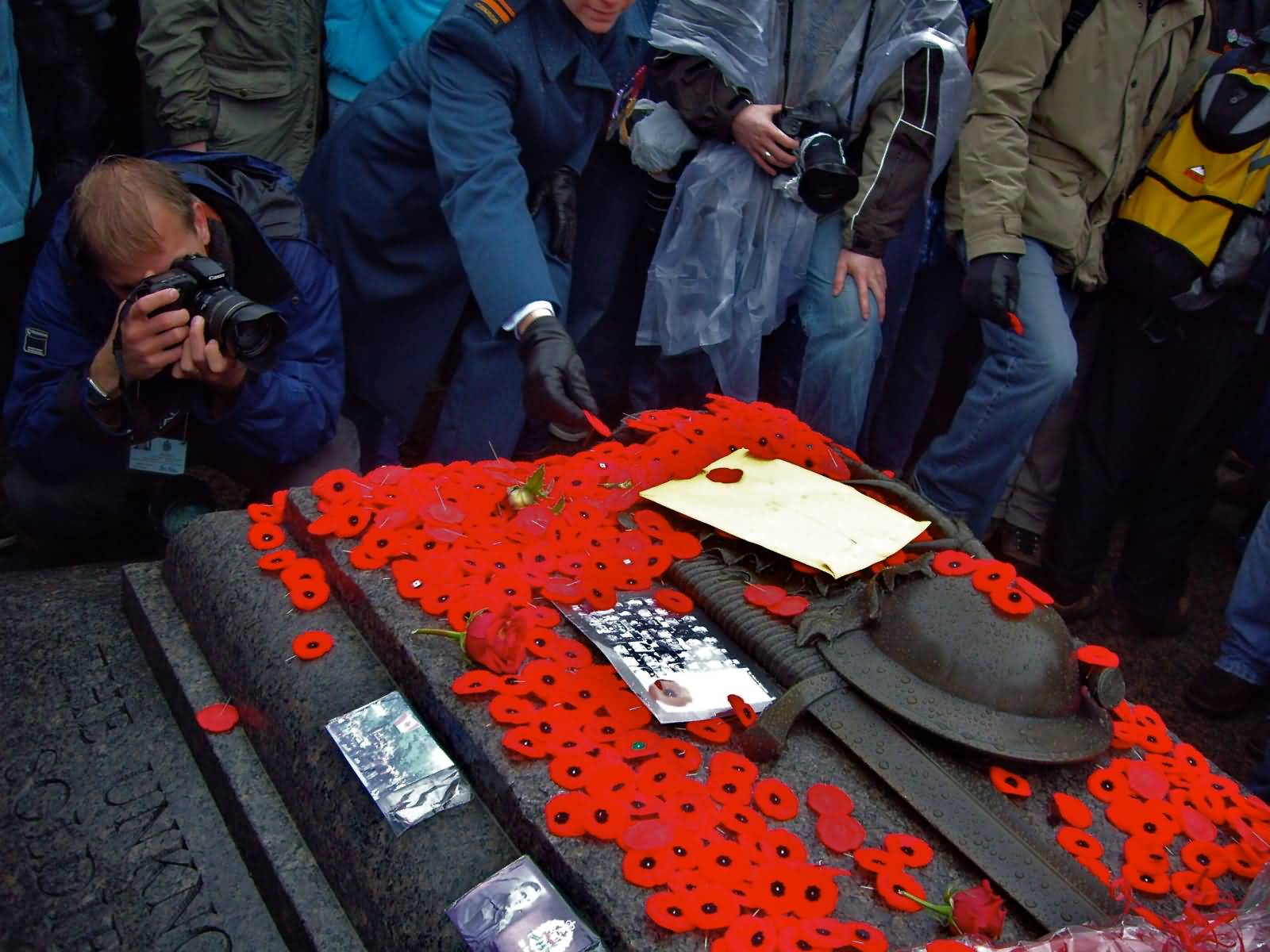Poppies Are Laid On The Tomb Of Soldier On Remembrance Day In Ottawa