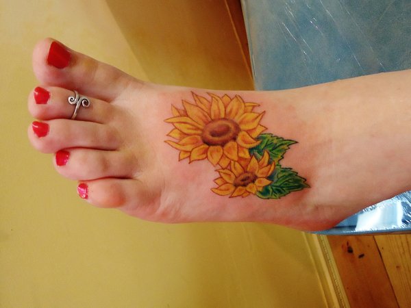 Realistic Sunflower Tattoo On Girl Left Foot