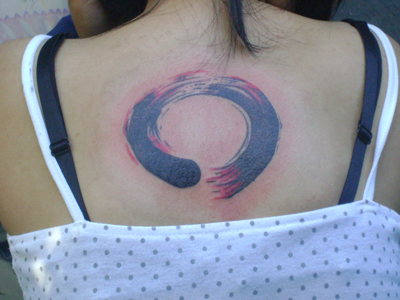 Red And Black Zen Enso Circle Tattoo On Upper Back