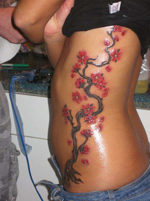 Red Cherry Blossom Flowers Tattoo On Girl Side Rib