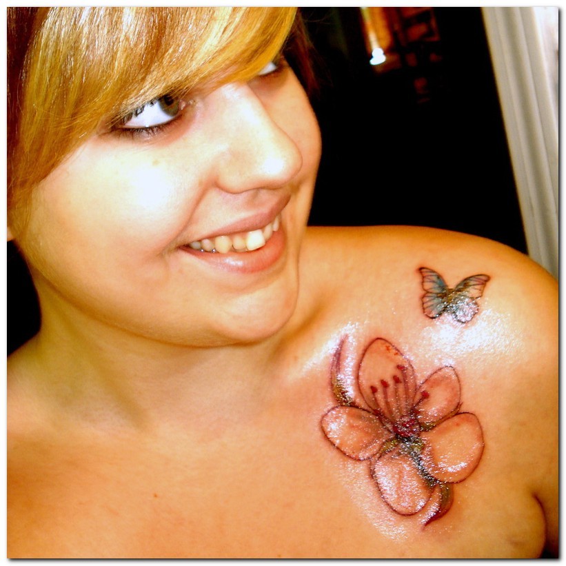 Rhododendron Flower With Flying Butterfly Tattoo On Girl Left Front Shoulder