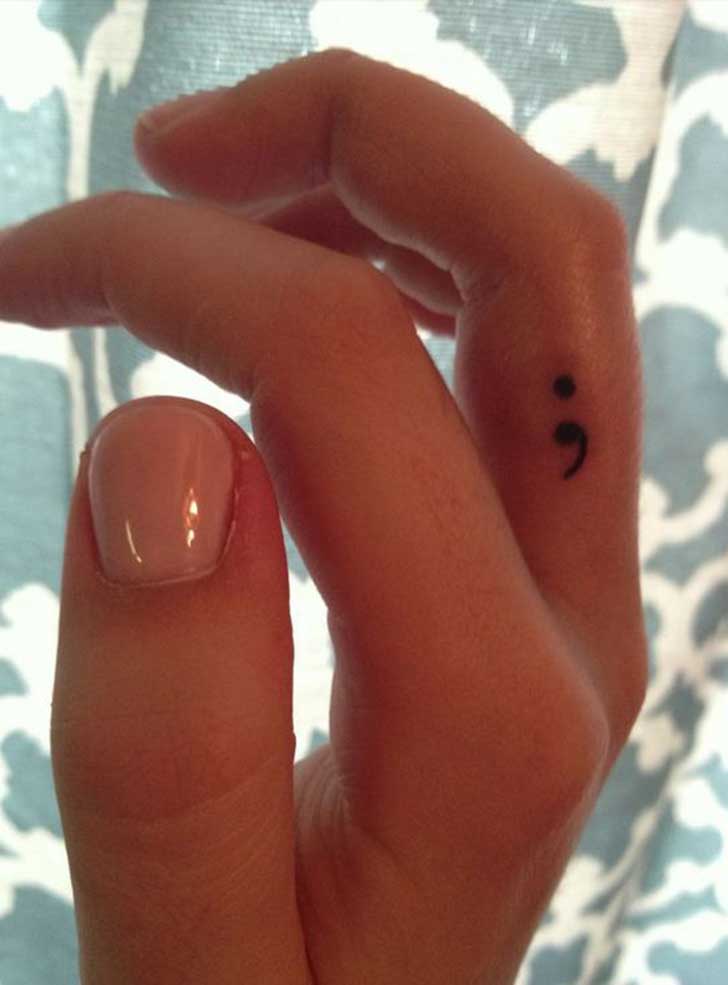 Semicolon Tattoo On Girl Side Finger