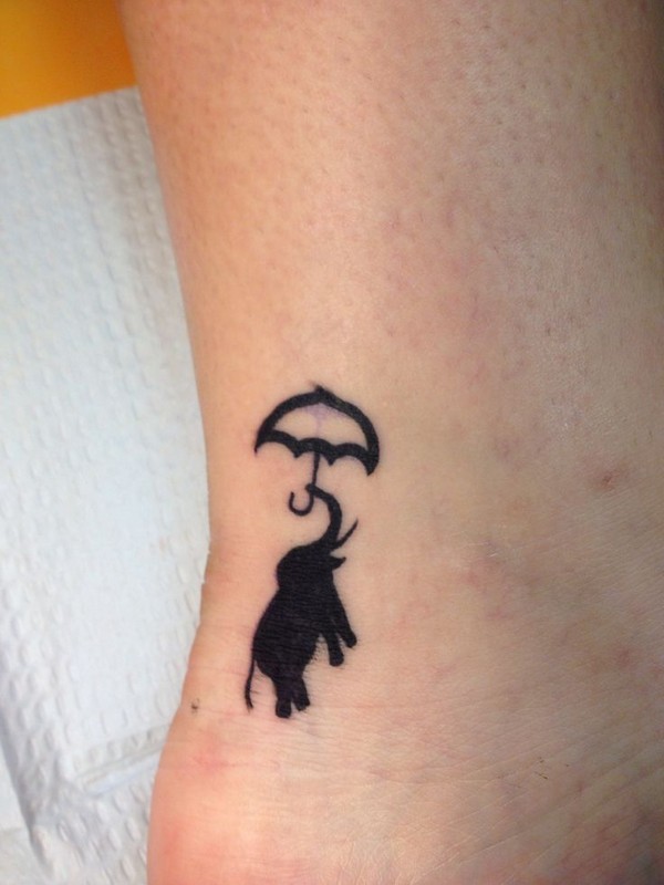 Silhouette Baby Elephant With Umbrella Tattoo On Ankle