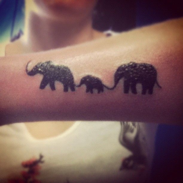 Silhouette Elephant Family Tattoo On Arm