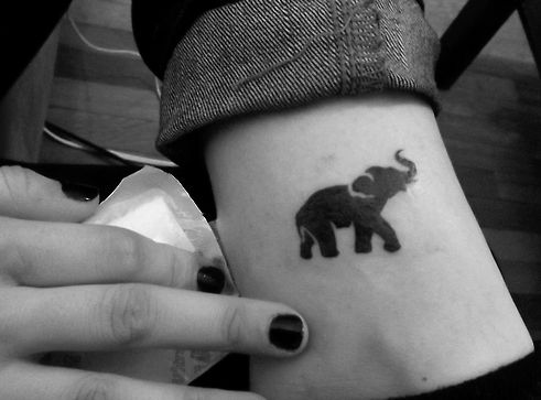 Silhouette Small Elephant Tattoo Design For Girl Leg