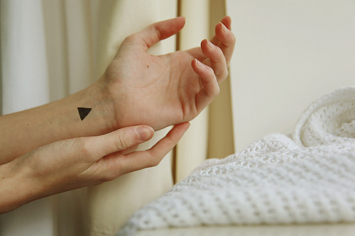 Silhouette Triangle Tattoo On Left Wrist